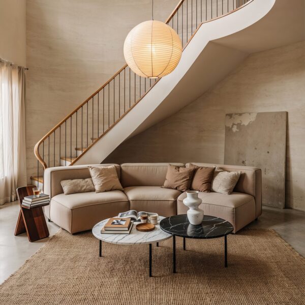 Double-height lounge finished in Travertine Monocolor